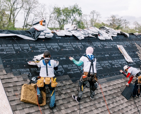 Roof Replacement team installing a new roof