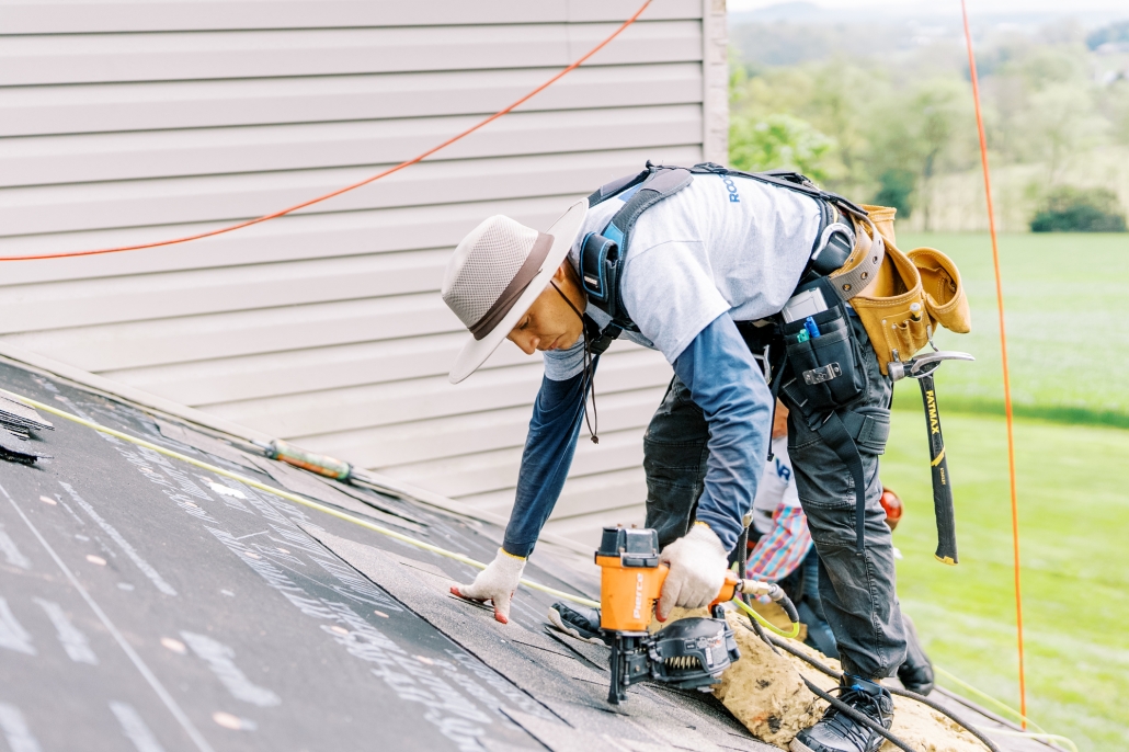 Roofer undertaking roof repair